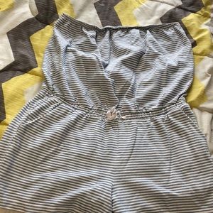 Sleeveless Light blue and white striped romper.